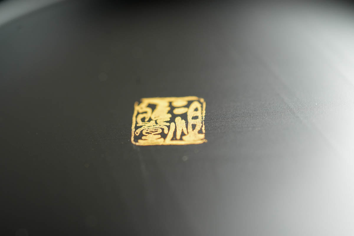 Gold-embossed mark of the Japanese Authentic Lacquer Artisans Union.Gold-embossed mark of the Japanese Authentic Lacquer Artisans Union.